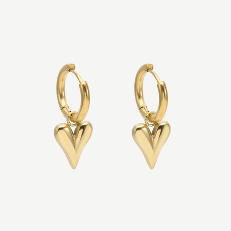 Pendientes Sculptural Heart en latón con baño de oro 18K, diseño minimalista de corazón alargado. Ligeros, elegantes y versátiles para looks diarios o de noche.
